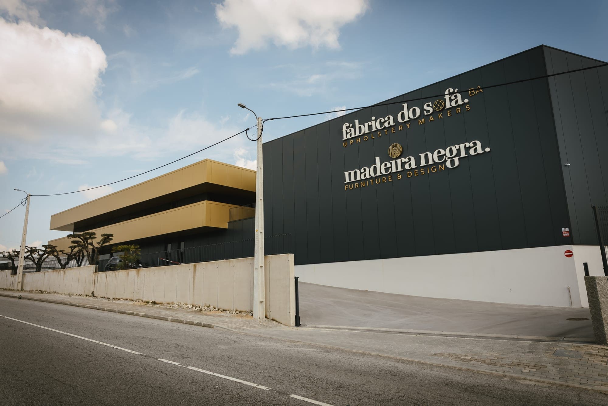 Exterior of the Fábrica do Sofá and Madeira Negra building in Paços de Ferreira